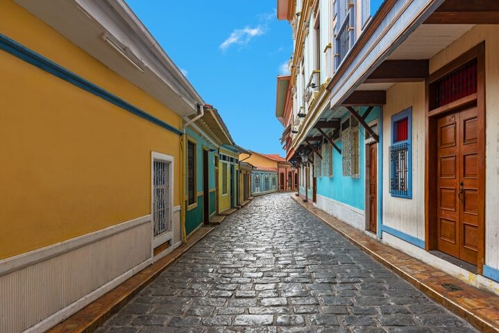 Cityscape in a colorful street of Guayaquil city, famous of its cobblestones and wooden colonial architecture, Las Penas district on Santa Ana Hill, Ecuador.