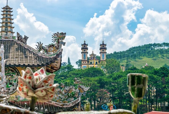 Ancient asian temple stands on green hill in Dalat Vietnam